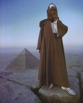 A photo of an Egyptian tour guide on top of the great pyramid in Giza, Egypt 1986