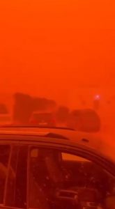 A rare natural phenomenon causes a sandstorm to turn everything red in Libya