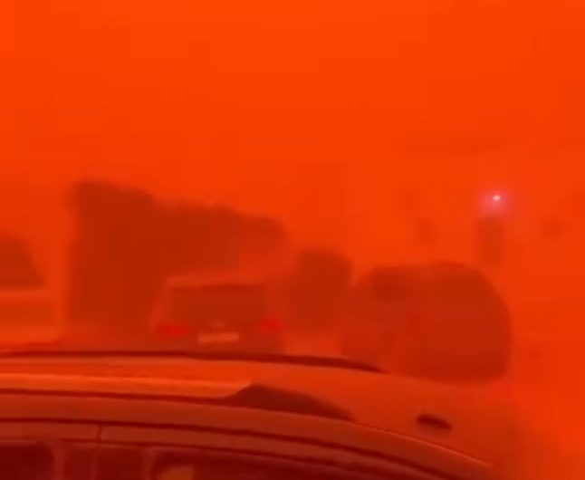 A rare natural phenomenon causes a sandstorm to turn everything red in Libya