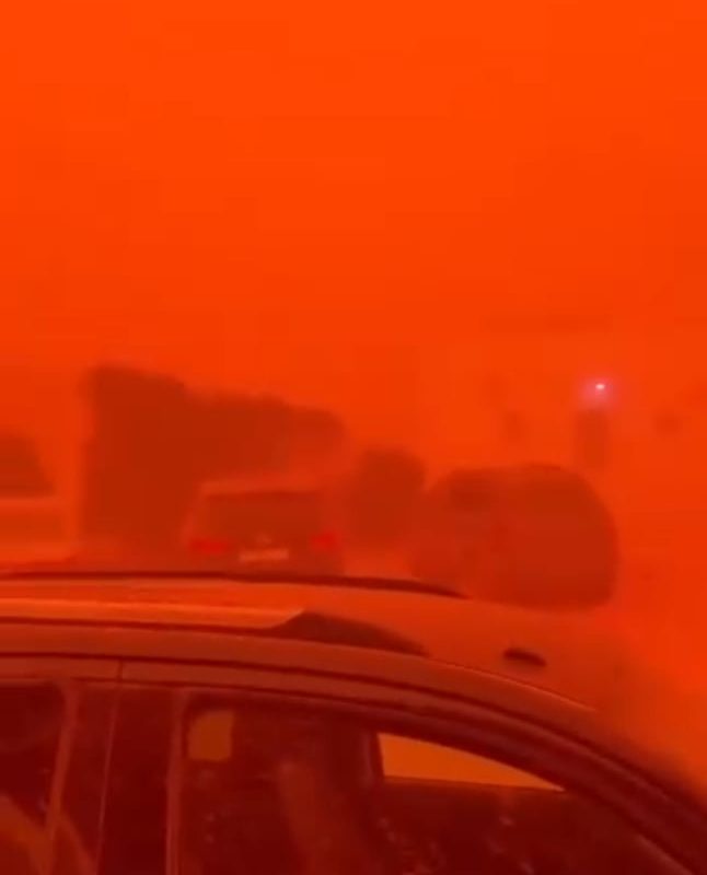 A rare natural phenomenon causes a sandstorm to turn everything red in Libya
