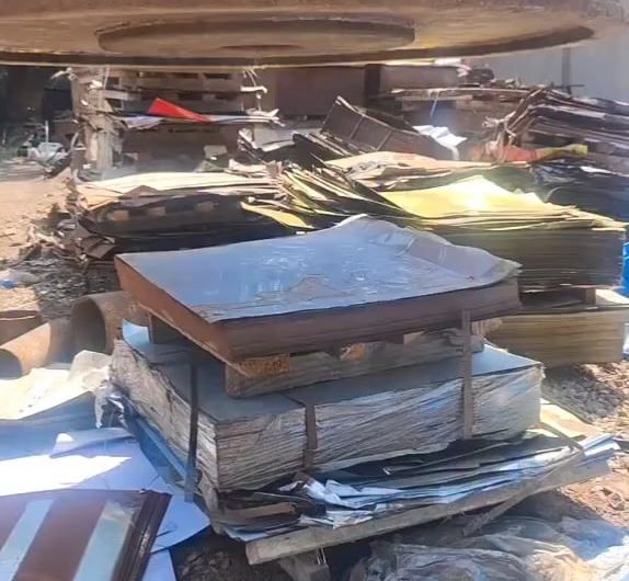 An electromagnet pulls thin sheets of metal