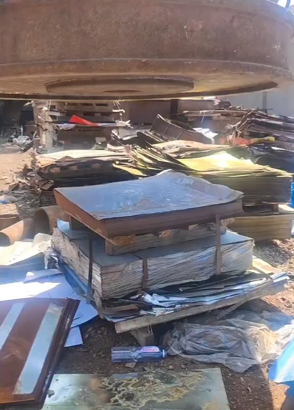 An electromagnet pulls thin sheets of metal