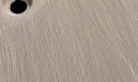 Applying resin coat to sanded carbon fiber components