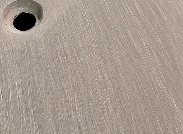 Applying resin coat to sanded carbon fiber components