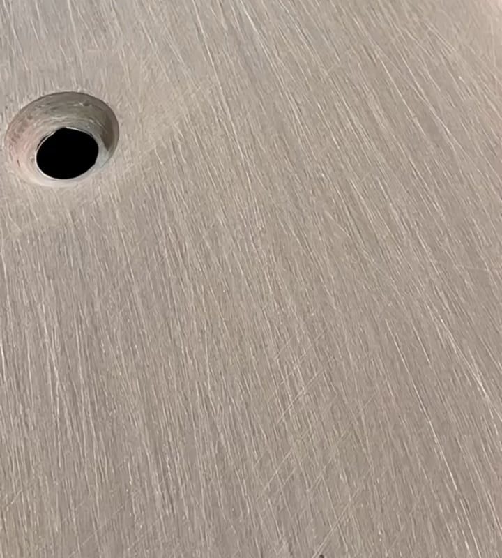 Applying resin coat to sanded carbon fiber components