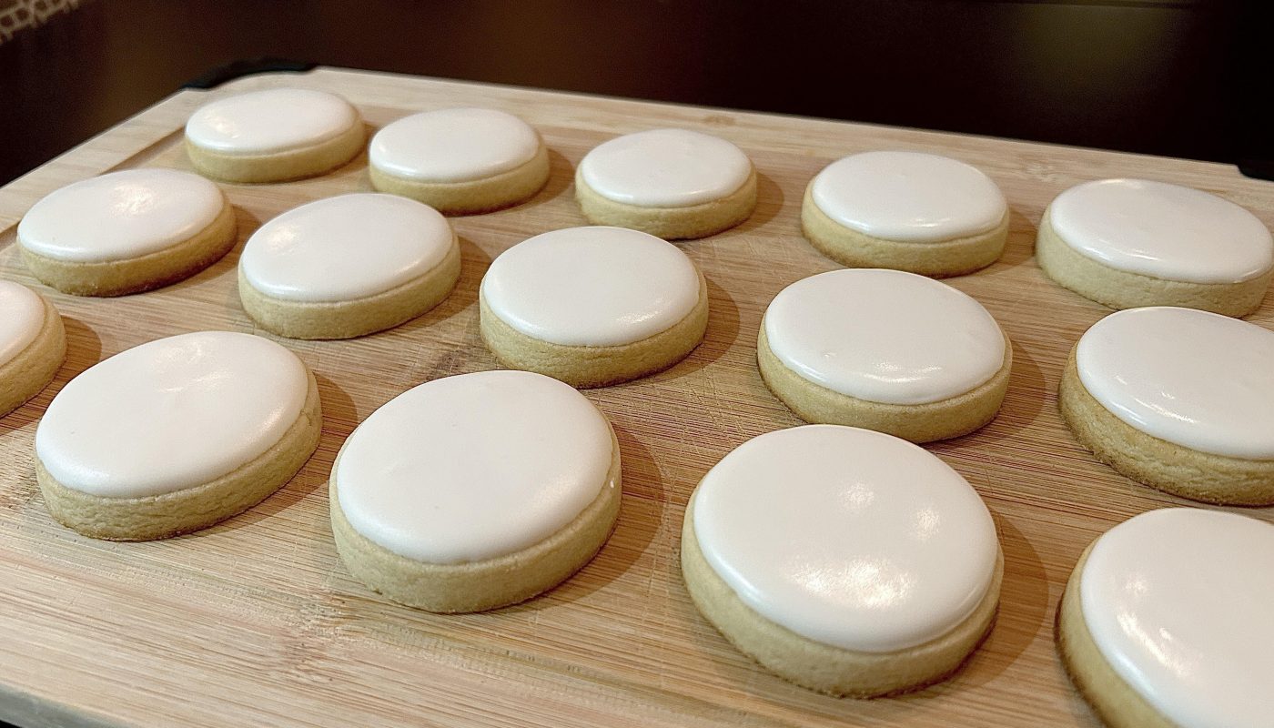 Base layer of icing on 15 sugar cookies