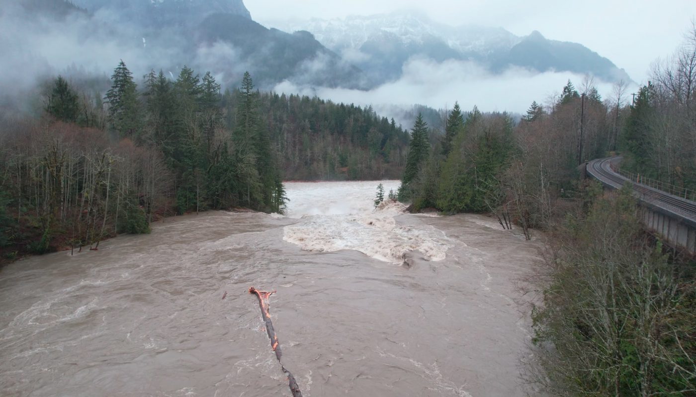 Big log goes over raging waterfall during Washington floods