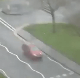 Biker gets off bike in order to help a women cross the street