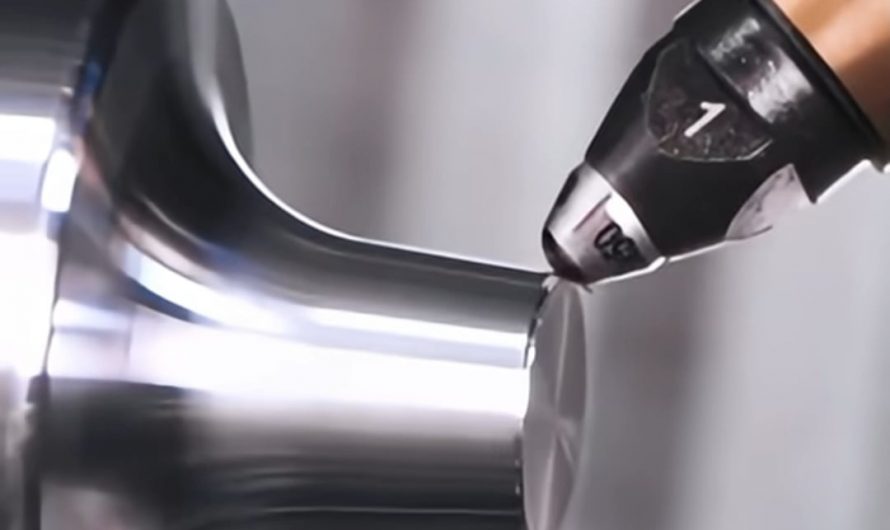 CNC diamond-tipped burnisher polishing a steel tool attachment