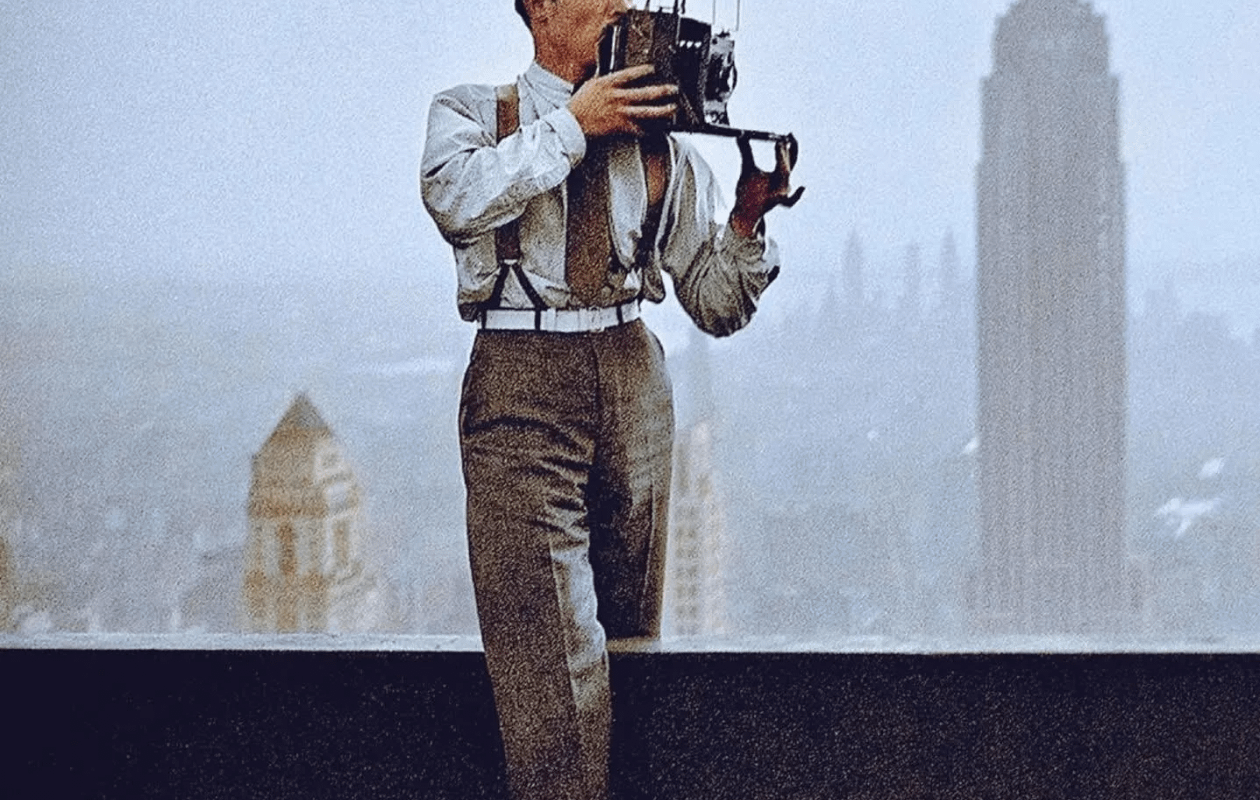 Charles Clyde Ebbets, the photographer generally credited with taking the famous "Lunch atop a Skyscraper" image, positioned on a beam taking a photograph in New York City in 1932 during the construction of the RCA Building.