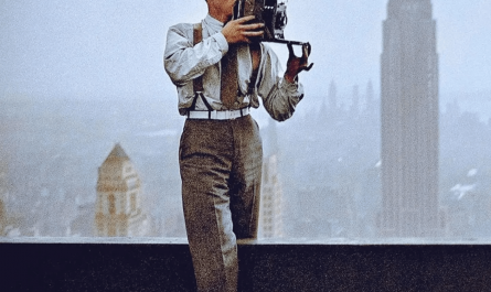 Charles Clyde Ebbets, the photographer generally credited with taking the famous "Lunch atop a Skyscraper" image, positioned on a beam taking a photograph in New York City in 1932 during the construction of the RCA Building.