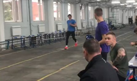 Competitive firefighter climbs up ladder