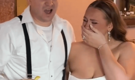 Couple reacts to a painting of them on their wedding day.