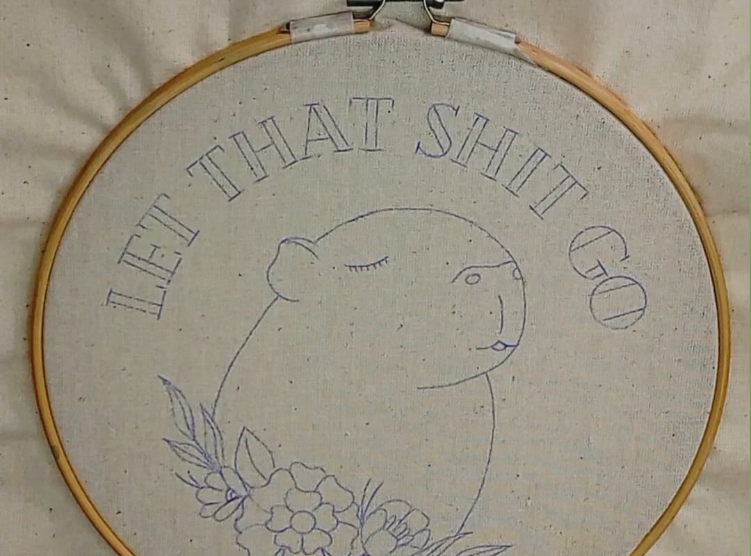 Creation process of a mixed-media piece combining watercolor and needlework.