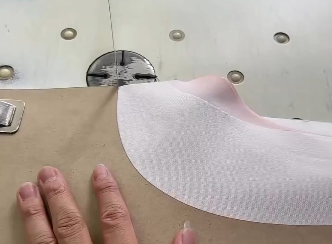 Cutting fabric so smoothly it looks like he’s slicing through foam