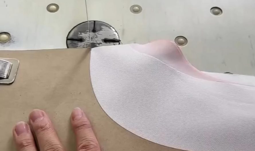 Cutting fabric so smoothly it looks like he’s slicing through foam