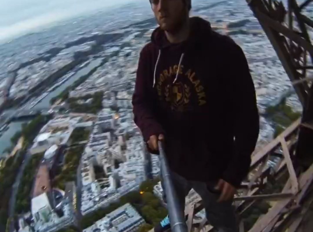 Dude climbs the Eiffel Tower without permission.