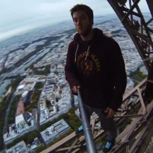 Dude climbs the Eiffel Tower without permission.