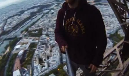 Dude climbs the Eiffel Tower without permission.