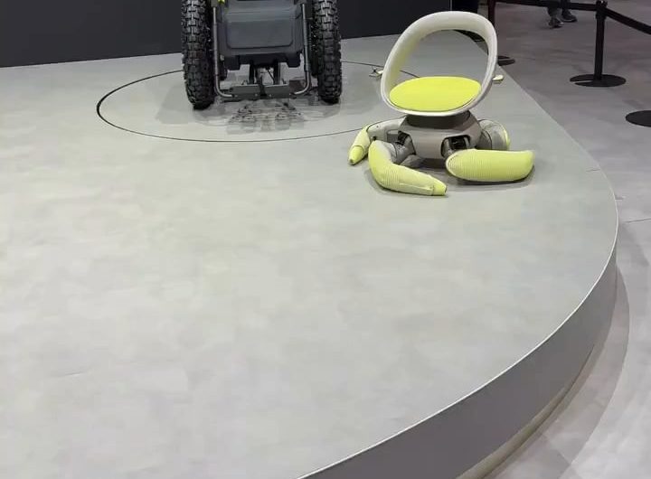 During Japan Mobility Show 2025, Toyota revealed the “Walk Me,” a concept autonomous wheelchair with foldable tentacle legs that can climb stairs and sit on the floor. The wheelchair should help people with reduced mobility to move around places where traditional wheelchairs aren’t able to reach.