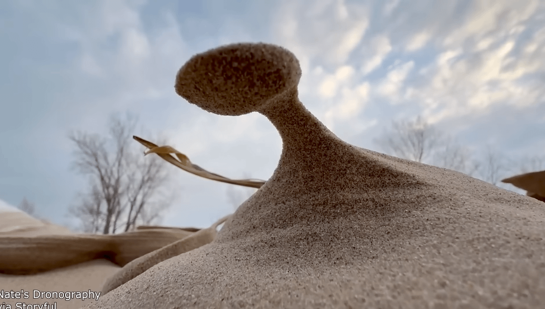 During cold periods at lake michigan, strong winds mixed with freezing colds can create natural structures made of of frozen sand.