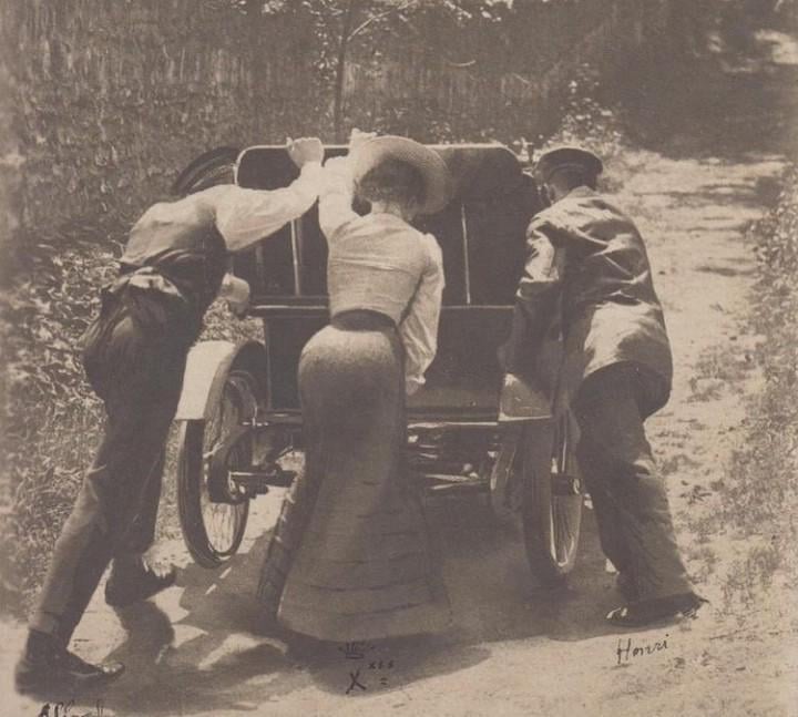 Early cars used gravity to move the fuel to the motor which made climbing hills dificult. One trick was putting them in reverse or try to go up as fast as possible before it stalled, like the car in the photo. Source in comment. Photo circa 1900s