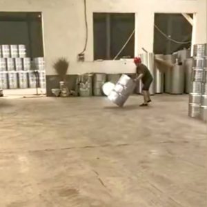 Factory worker spins barrels into place with pinpoint accuracy