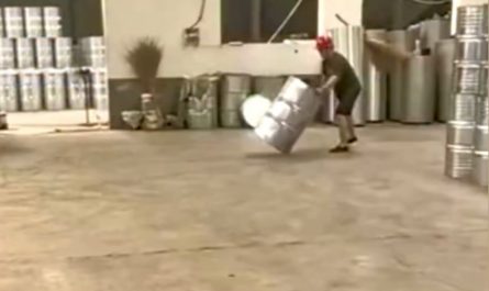 Factory worker spins barrels into place with pinpoint accuracy