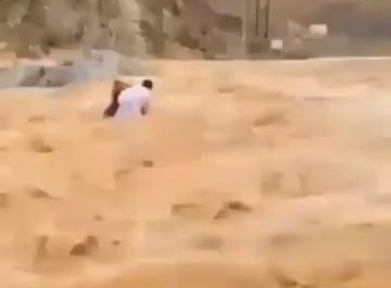 Here is a Man Saving two kids from certain death.