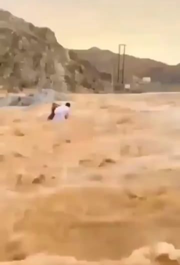 Here is a Man Saving two kids from certain death.