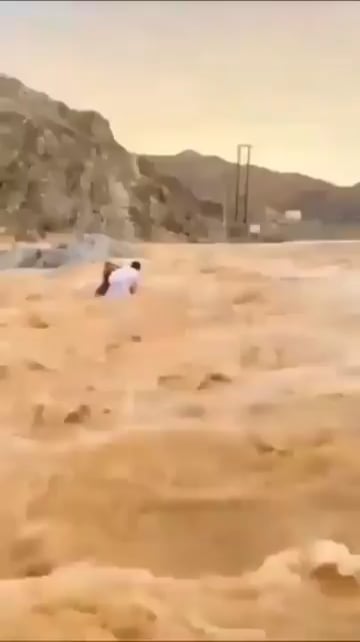 Here is a Man Saving two kids from certain death.