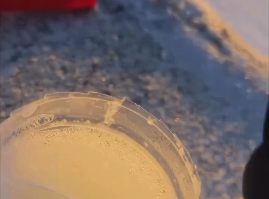 Ice crystals forming on a soap film at sunset
