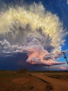 In West Texas, storm chaser Laura Rowe captured this fantastic shot of a mature supercell thunderstorm, illuminated at varying heights by the setting sun.