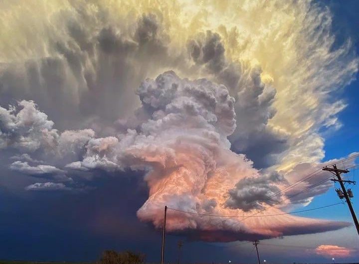 In West Texas, storm chaser Laura Rowe captured this fantastic shot of a mature supercell thunderstorm, illuminated at varying heights by the setting sun.