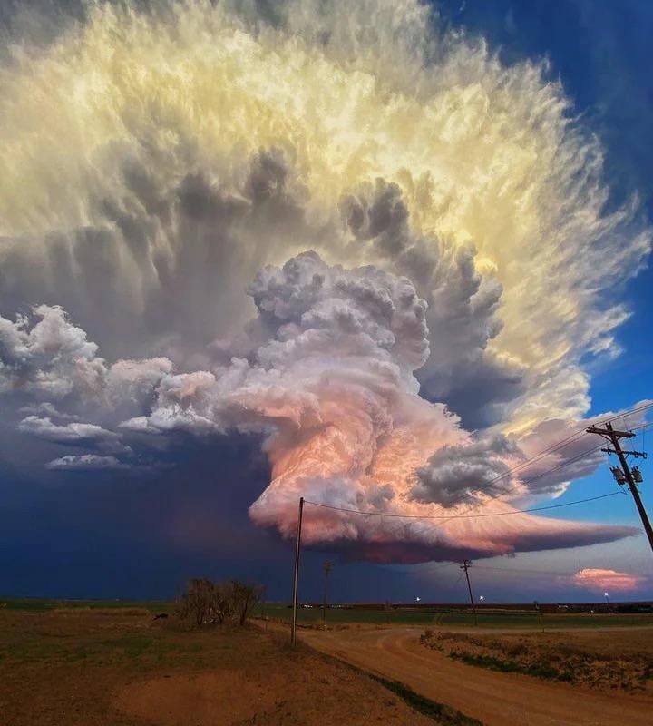 In West Texas, storm chaser Laura Rowe captured this fantastic shot of a mature supercell thunderstorm, illuminated at varying heights by the setting sun.