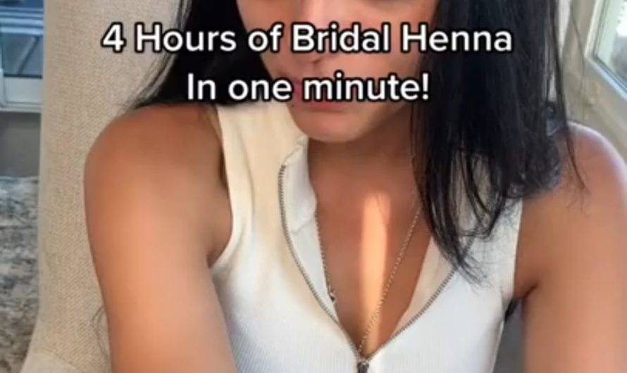 Intricate henna being applied for a bride