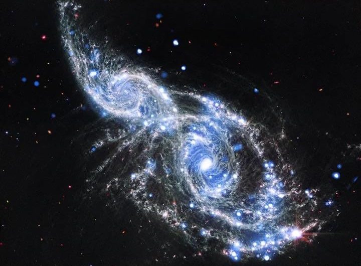 James Webb captures two galaxies, NGC 2207 and IC 2163, in the middle of a cosmic collision.