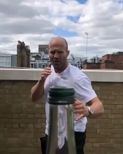 Jason Statham removing bottle cap with kick