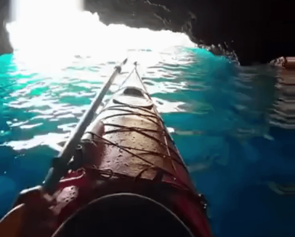 Kayaking upside down to swim out of a cave: