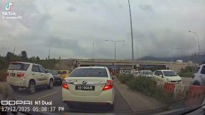 Malaysian Police rips off car door with bare hands.