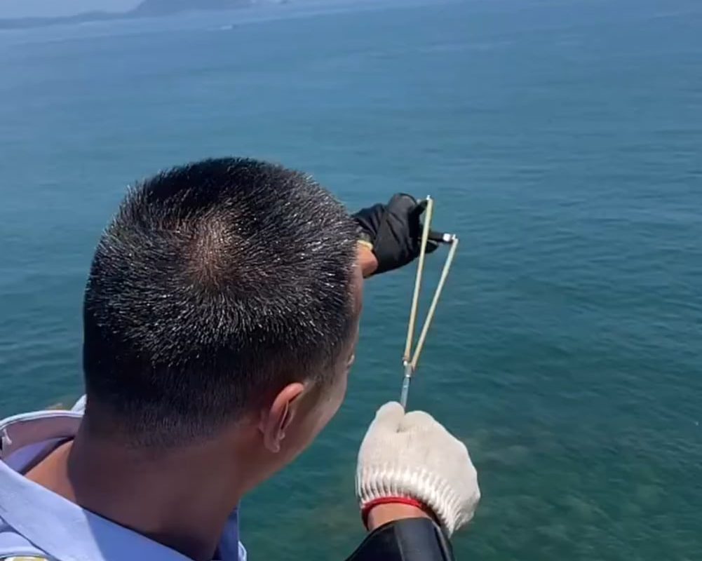 Man invents wrist-fired fishing slingshot that casts like Spider-Man.