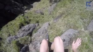 Man rescues crying lost lamb on a steep mountain and reunites it with its family