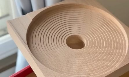 Marbles tumbling down wooden channels