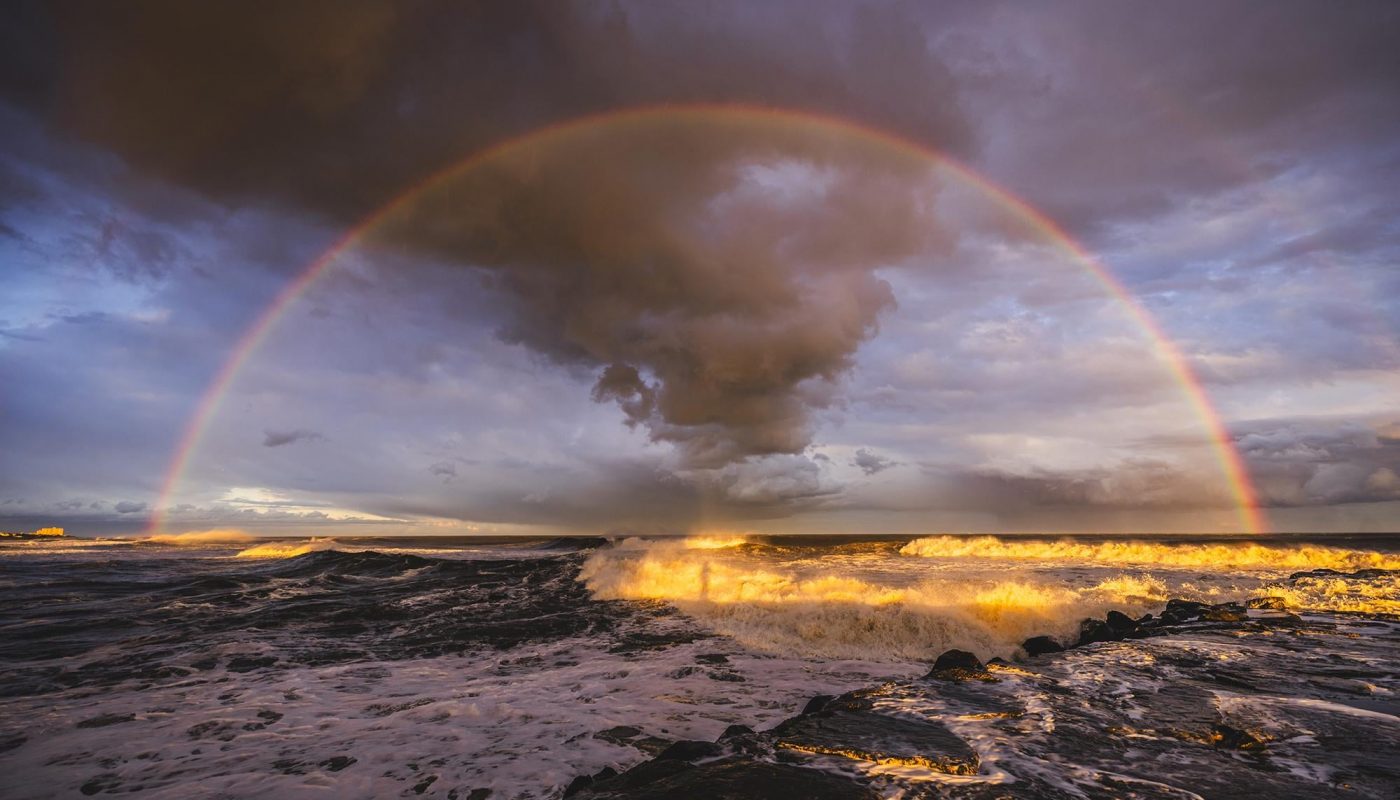 My shadow surrounded by a "glory" halo (also called a Brocken spectre) directly in the center of an intense rainbow 2 days before the winter solstice.