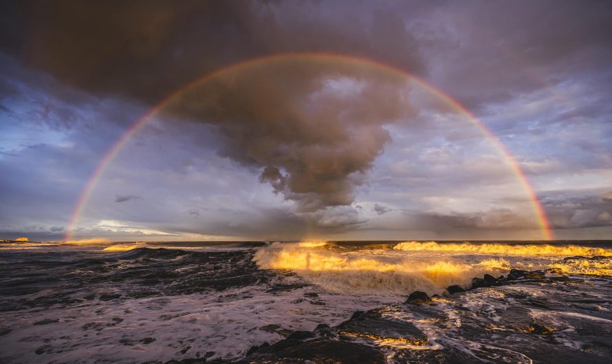 My shadow surrounded by a “glory” halo (also called a Brocken spectre) directly in the center of an intense rainbow 2 days before the winter solstice.