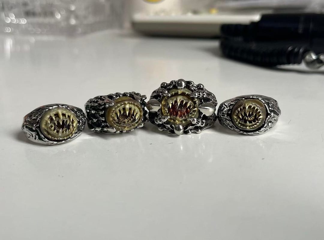 Ornaments made from the chitinous sucker rings of the giant Humboldt squid (Dosidicus gigas).