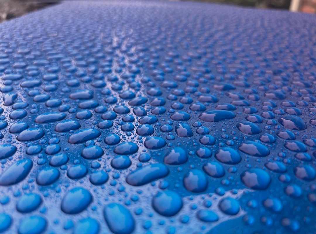 Pebbled water on ceramic coated car
