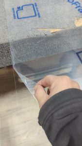Peeling an acrylic sheet