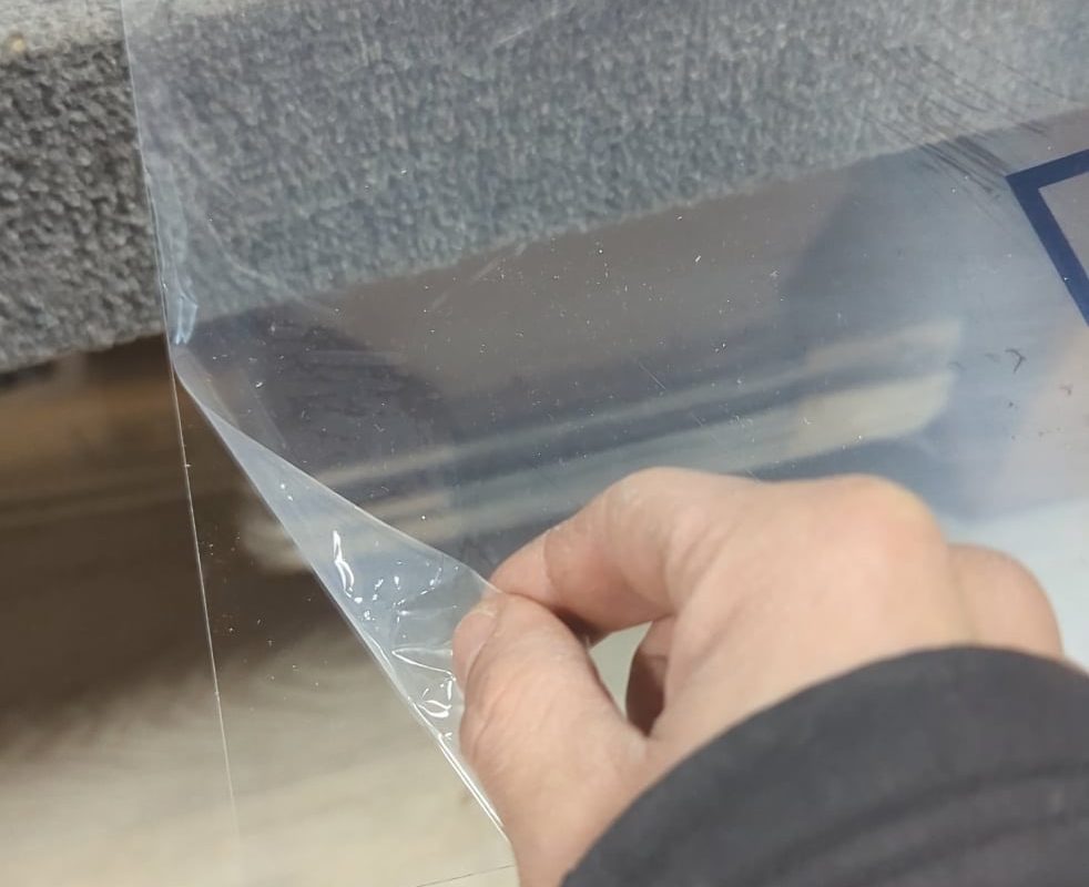 Peeling an acrylic sheet