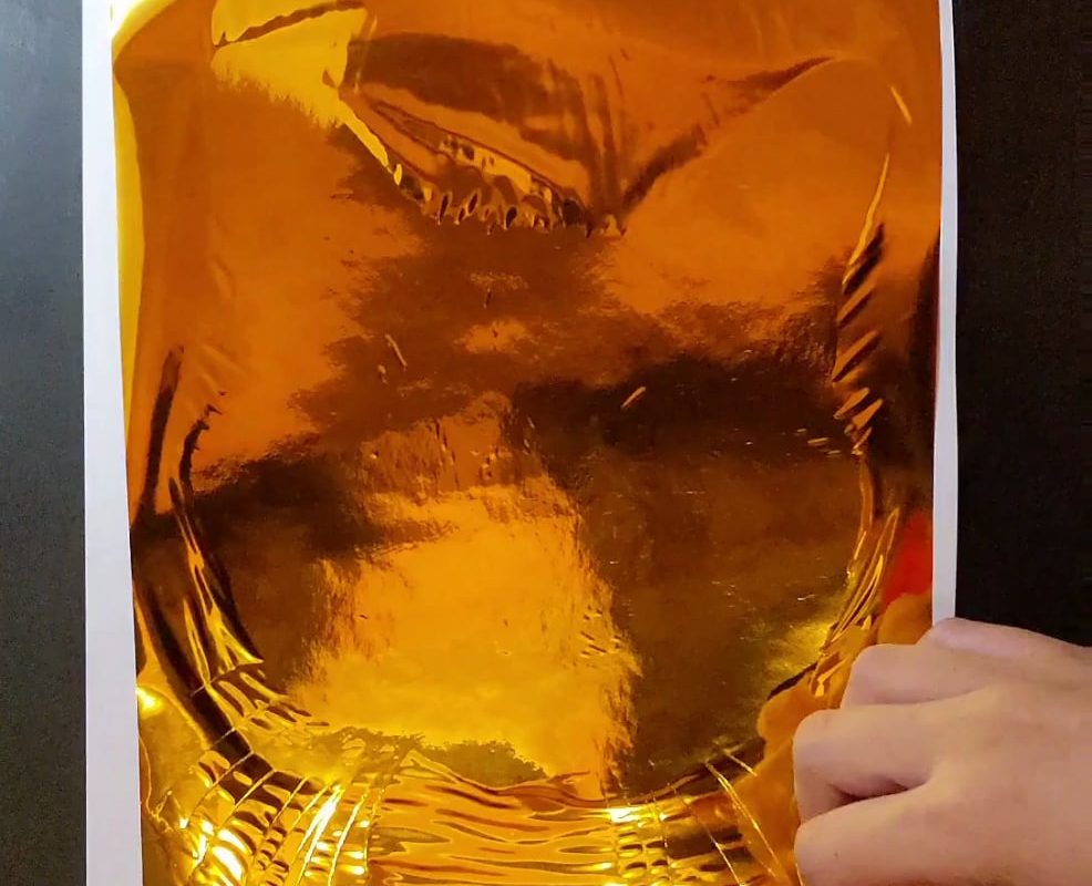 Peeling the foil off my drawing of Desmond the orange cat (OC)